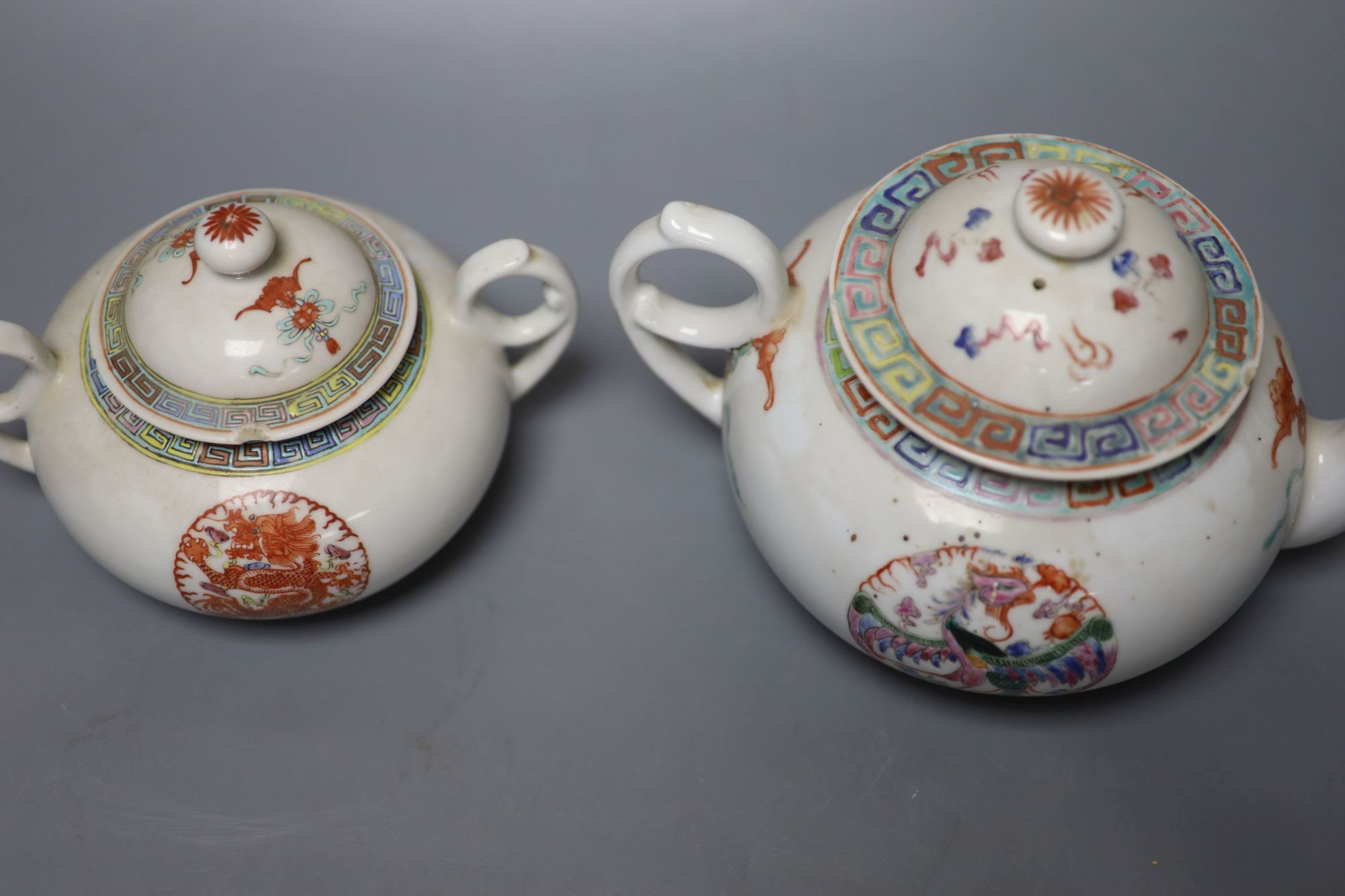 A Chinese famille rose teapot and sucrier, a 19th century Chinese bowl and a pair of blue and white bowls